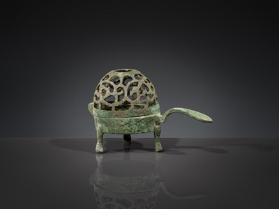 A SMALL BRONZE TRIPOD LAMP WITH A HINGED RETICULATED COVER, HAN DYNASTY