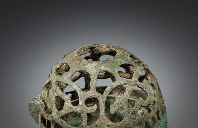 A SMALL BRONZE TRIPOD LAMP WITH A HINGED RETICULATED COVER, HAN DYNASTY