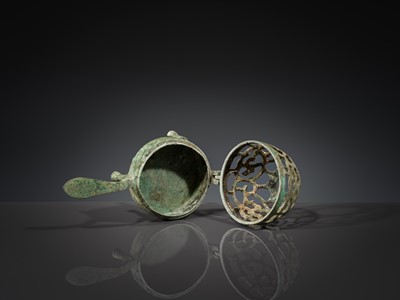 A SMALL BRONZE TRIPOD LAMP WITH A HINGED RETICULATED COVER, HAN DYNASTY