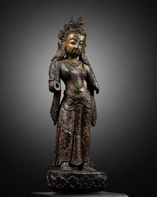 Lot 21 - A RARE PARCEL-GILT AND LACQUERED ZITAN FIGURE OF TARA, BHUTAN, 17TH - 18TH CENTURY