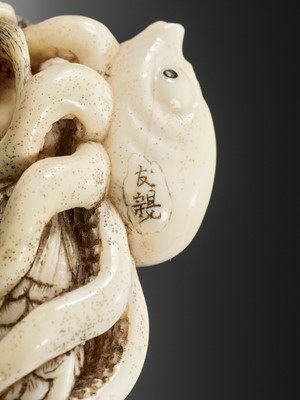 Lot 176 - TOMOCHIKA: A RARE IVORY NETSUKE OF A MERMAID ENAMORED WITH AN OCTOPUS