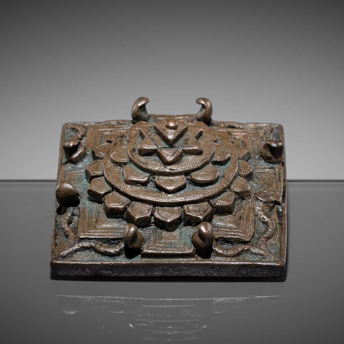Lot 213 - A BRONZE SRI YANTRA IN THE SHAPE OF MOUNT MERU, 17TH-18TH CENTURY