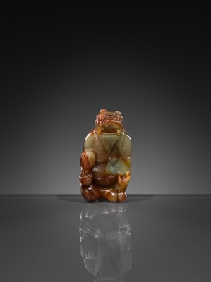 Lot 446 - A CELADON AND RUSSET JADE ‘MYTHICAL BEAST’ PENDANT, MING DYNASTY