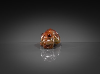 Lot 446 - A CELADON AND RUSSET JADE ‘MYTHICAL BEAST’ PENDANT, MING DYNASTY