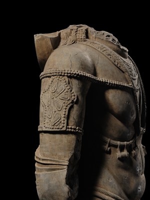 Lot 100 - A MONUMENTAL AND MASSIVE (820 KG) STONE TORSO OF A BODHISATTVA, KUSHAN PERIOD, ANCIENT REGION OF GANDHARA, CIRCA 3RD-4TH CENTURY