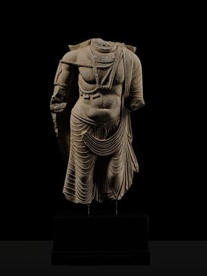 Lot 100 - A MONUMENTAL AND MASSIVE (820 KG) STONE TORSO OF A BODHISATTVA, KUSHAN PERIOD, ANCIENT REGION OF GANDHARA, CIRCA 3RD-4TH CENTURY