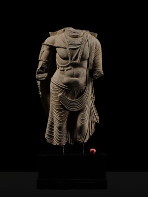 Lot 100 - A MONUMENTAL AND MASSIVE (820 KG) STONE TORSO OF A BODHISATTVA, KUSHAN PERIOD, ANCIENT REGION OF GANDHARA, CIRCA 3RD-4TH CENTURY
