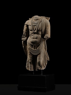 Lot 100 - A MONUMENTAL AND MASSIVE (820 KG) STONE TORSO OF A BODHISATTVA, KUSHAN PERIOD, ANCIENT REGION OF GANDHARA, CIRCA 3RD-4TH CENTURY