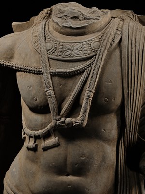 Lot 100 - A MONUMENTAL AND MASSIVE (820 KG) STONE TORSO OF A BODHISATTVA, KUSHAN PERIOD, ANCIENT REGION OF GANDHARA, CIRCA 3RD-4TH CENTURY