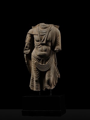 Lot 100 - A MONUMENTAL AND MASSIVE (820 KG) STONE TORSO OF A BODHISATTVA, KUSHAN PERIOD, ANCIENT REGION OF GANDHARA, CIRCA 3RD-4TH CENTURY