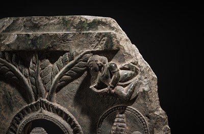 Lot 68 - A RARE AND IMPORTANT BLACK STONE STELE OF BUDDHA PREACHING THE FIRST SERMON AT SARNATH, PROBABLY RATNAGIRI, 9TH-12TH CENTURY