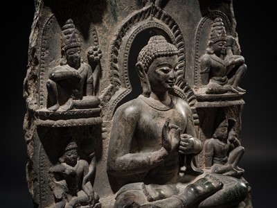 Lot 68 - A RARE AND IMPORTANT BLACK STONE STELE OF BUDDHA PREACHING THE FIRST SERMON AT SARNATH, PROBABLY RATNAGIRI, 9TH-12TH CENTURY