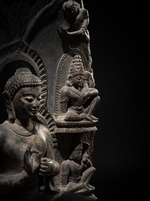 Lot 68 - A RARE AND IMPORTANT BLACK STONE STELE OF BUDDHA PREACHING THE FIRST SERMON AT SARNATH, PROBABLY RATNAGIRI, 9TH-12TH CENTURY