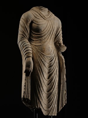 Lot 58 - A RARE AND MONUMENTAL (175 CM HIGH) GRAY SCHIST TORSO OF BUDDHA SHAKYAMUNI, KUSHAN PERIOD, ANCIENT REGION OF GANDHARA, CIRCA 2ND-3RD CENTURY