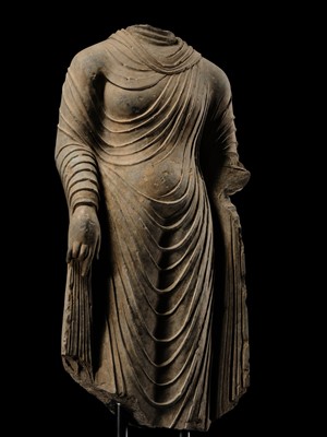 Lot 58 - A RARE AND MONUMENTAL (175 CM HIGH) GRAY SCHIST TORSO OF BUDDHA SHAKYAMUNI, KUSHAN PERIOD, ANCIENT REGION OF GANDHARA, CIRCA 2ND-3RD CENTURY