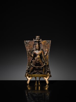 Lot 75 - A BRONZE CEREMONIAL SHIELD DEPICTING VIRABHADRA, SOUTH INDIA, 16TH-17TH CENTURY