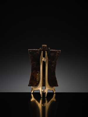 Lot 75 - A BRONZE CEREMONIAL SHIELD DEPICTING VIRABHADRA, SOUTH INDIA, 16TH-17TH CENTURY