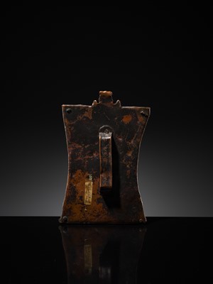 Lot 75 - A BRONZE CEREMONIAL SHIELD DEPICTING VIRABHADRA, SOUTH INDIA, 16TH-17TH CENTURY