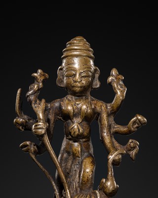 Lot 79 - A SMALL BRONZE FIGURE OF DURGA SLAYING THE BUFFALO-DEMON MAHISHA, DECCAN, 17TH-18TH CENTURY