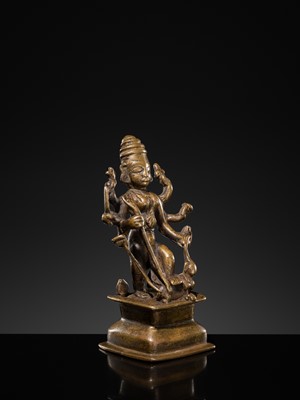Lot 79 - A SMALL BRONZE FIGURE OF DURGA SLAYING THE BUFFALO-DEMON MAHISHA, DECCAN, 17TH-18TH CENTURY