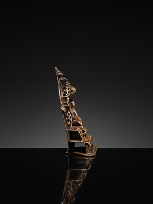 Lot 73 - A JAIN COPPER- AND SILVER-INLAID BRASS SHRINE OF A TIRTHANKARA, DATED 1325