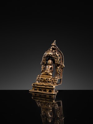Lot 73 - A JAIN COPPER- AND SILVER-INLAID BRASS SHRINE OF A TIRTHANKARA, DATED 1325