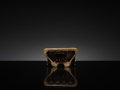 Lot 73 - A JAIN COPPER- AND SILVER-INLAID BRASS SHRINE OF A TIRTHANKARA, DATED 1325