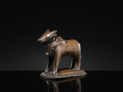Lot 72 - A SILVER-INLAID BRONZE FIGURE OF NANDI, HIMACHAL PRADESH, 10TH CENTURY