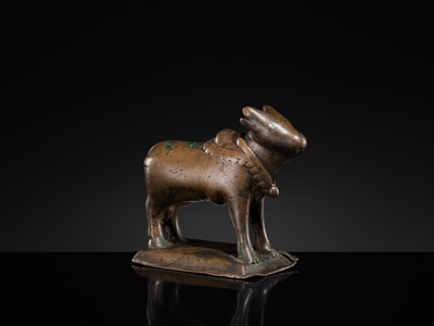 Lot 72 - A SILVER-INLAID BRONZE FIGURE OF NANDI, HIMACHAL PRADESH, 10TH CENTURY
