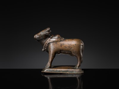 Lot 72 - A SILVER-INLAID BRONZE FIGURE OF NANDI, HIMACHAL PRADESH, 10TH CENTURY