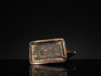 Lot 72 - A SILVER-INLAID BRONZE FIGURE OF NANDI, HIMACHAL PRADESH, 10TH CENTURY