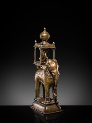 Lot 76 - A BRONZE MODEL OF AN ELEPHANT WITH CANOPY CONTAINING A BRASS FIGURE OF MALE DEITY, DECCAN, 17TH CENTURY