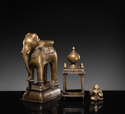 Lot 76 - A BRONZE MODEL OF AN ELEPHANT WITH CANOPY CONTAINING A BRASS FIGURE OF MALE DEITY, DECCAN, 17TH CENTURY