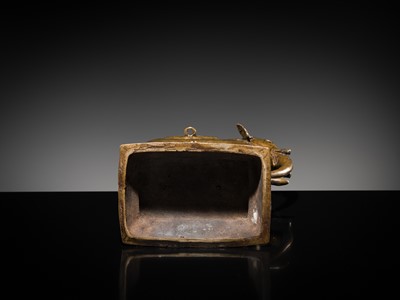 Lot 76 - A BRONZE MODEL OF AN ELEPHANT WITH CANOPY CONTAINING A BRASS FIGURE OF MALE DEITY, DECCAN, 17TH CENTURY