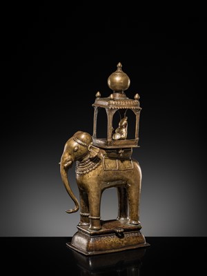 Lot 76 - A BRONZE MODEL OF AN ELEPHANT WITH CANOPY CONTAINING A BRASS FIGURE OF MALE DEITY, DECCAN, 17TH CENTURY
