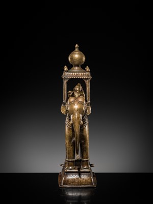 Lot 76 - A BRONZE MODEL OF AN ELEPHANT WITH CANOPY CONTAINING A BRASS FIGURE OF MALE DEITY, DECCAN, 17TH CENTURY
