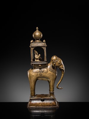 Lot 76 - A BRONZE MODEL OF AN ELEPHANT WITH CANOPY CONTAINING A BRASS FIGURE OF MALE DEITY, DECCAN, 17TH CENTURY
