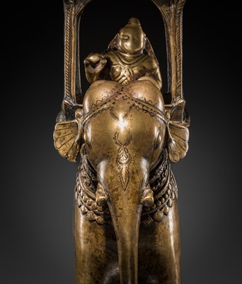 Lot 76 - A BRONZE MODEL OF AN ELEPHANT WITH CANOPY CONTAINING A BRASS FIGURE OF MALE DEITY, DECCAN, 17TH CENTURY