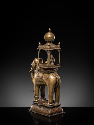 Lot 76 - A BRONZE MODEL OF AN ELEPHANT WITH CANOPY CONTAINING A BRASS FIGURE OF MALE DEITY, DECCAN, 17TH CENTURY