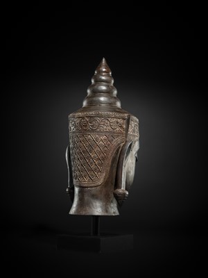 Lot 35 - A MONUMENTAL (88 CM HIGH) BRONZE HEAD OF CROWNED BUDDHA, PHRA CHAO SONG KHRUANG (‘A LORD WEARING ORNAMENTS’), AYUTTHAYA PERIOD