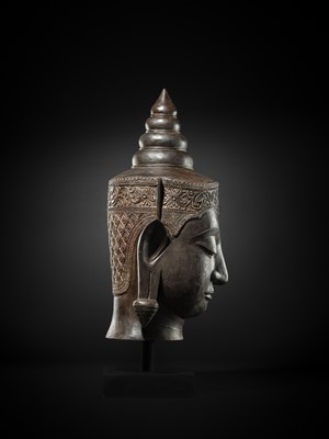Lot 35 - A MONUMENTAL (88 CM HIGH) BRONZE HEAD OF CROWNED BUDDHA, PHRA CHAO SONG KHRUANG (‘A LORD WEARING ORNAMENTS’), AYUTTHAYA PERIOD