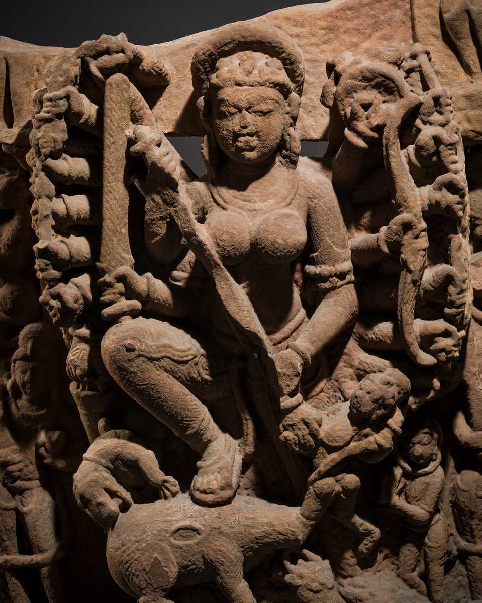 Lot 67 - A RED SANDSTONE RELIEF OF DURGA MAHISHASURAMARDINI, CENTRAL INDIA, CIRCA 10TH CENTURY
