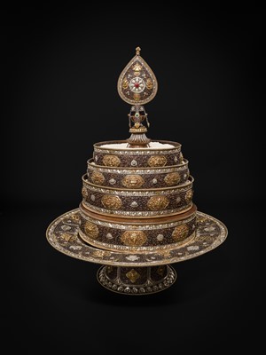 Lot 47 - A MONUMENTAL (142 CM) PARCEL-GILT COPPER AND SILVER REPOUSSÉ GRAIN MANDALA SET, TIBET, 20TH CENTURY