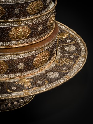 Lot 47 - A MONUMENTAL (142 CM) PARCEL-GILT COPPER AND SILVER REPOUSSÉ GRAIN MANDALA SET, TIBET, 20TH CENTURY