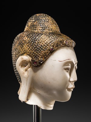 Lot 19 - A MAGNIFICENT LARGE GILT AND PAINTED WHITE MARBLE HEAD OF BUDDHA, MANDALAY, 18TH-19TH CENTURY