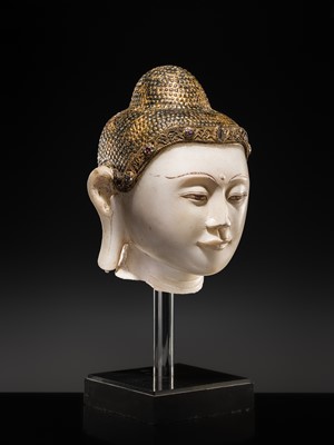 Lot 19 - A MAGNIFICENT LARGE GILT AND PAINTED WHITE MARBLE HEAD OF BUDDHA, MANDALAY, 18TH-19TH CENTURY