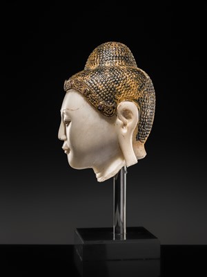 Lot 19 - A MAGNIFICENT LARGE GILT AND PAINTED WHITE MARBLE HEAD OF BUDDHA, MANDALAY, 18TH-19TH CENTURY