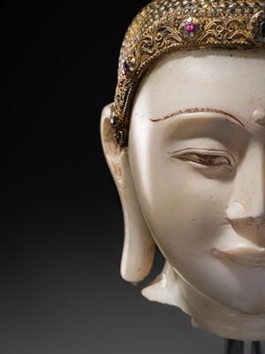 Lot 19 - A MAGNIFICENT LARGE GILT AND PAINTED WHITE MARBLE HEAD OF BUDDHA, MANDALAY, 18TH-19TH CENTURY