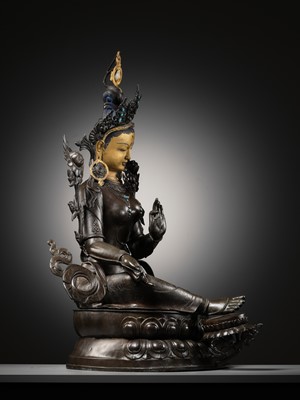 Lot 92 - A LARGE AND IMPRESSIVE BRONZE FIGURE OF GREEN TARA, NEPAL, CIRCA 1900