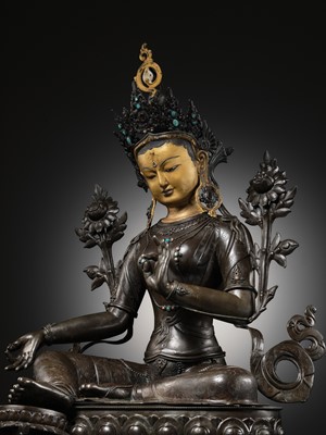 Lot 92 - A LARGE AND IMPRESSIVE BRONZE FIGURE OF GREEN TARA, NEPAL, CIRCA 1900